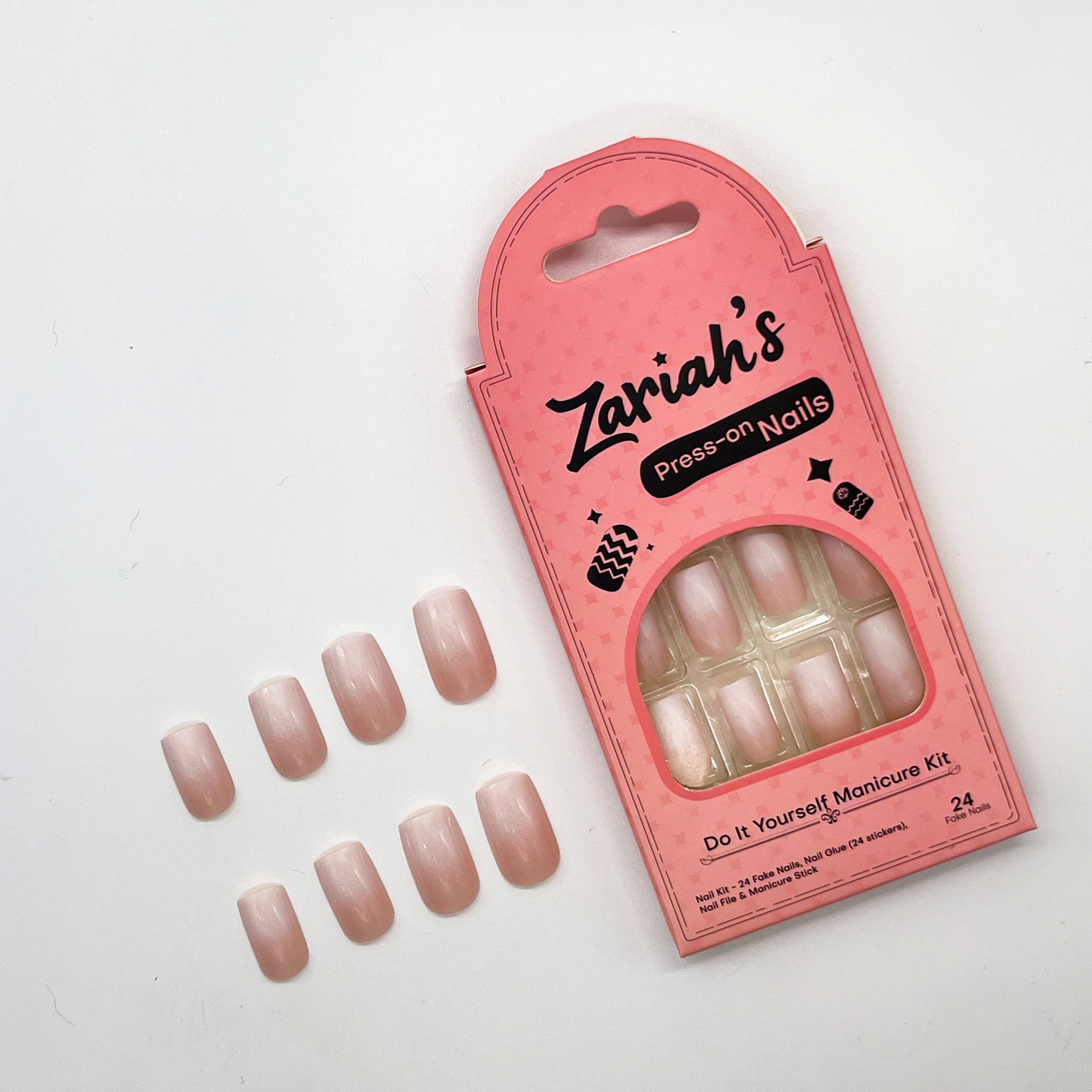 Pink packaging of Zeriah's press-on nails with nails displayed on a white background